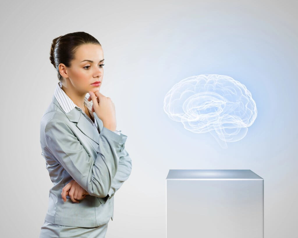 Female professional studies a hologram of the human brain, possibly considering its connection to obesity.